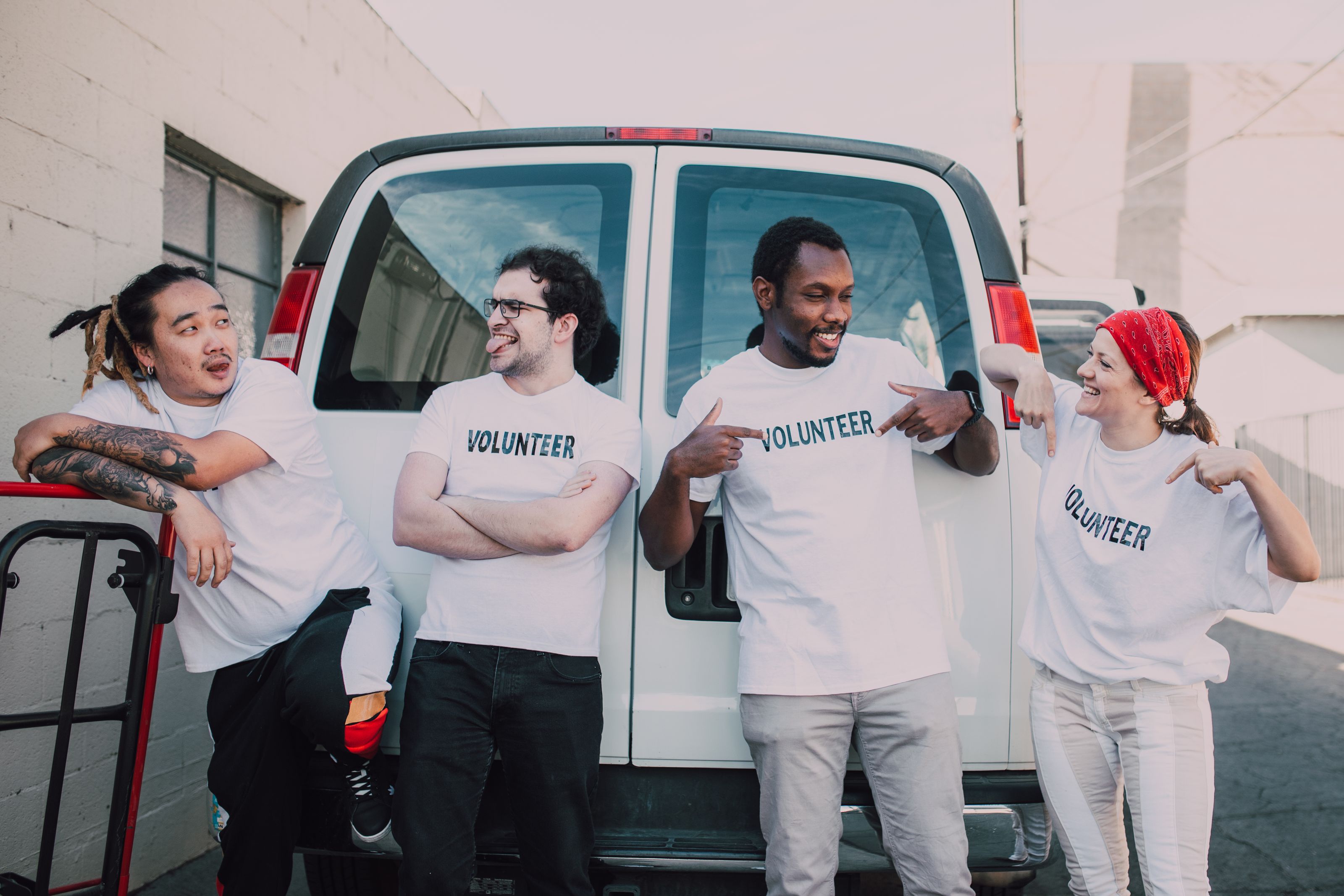 Nonprofit volunteers together outside their van